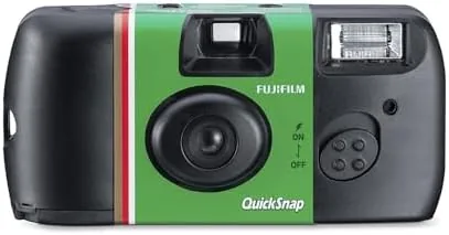 Close up of the QuickSnap camera in a hand showing the shutter and film advance wheel