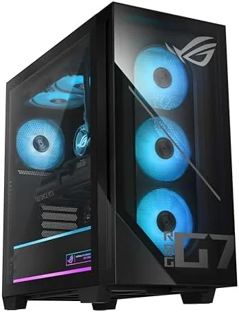 The ROG G700 next to a gaming laptop and a stack of DIY PC components