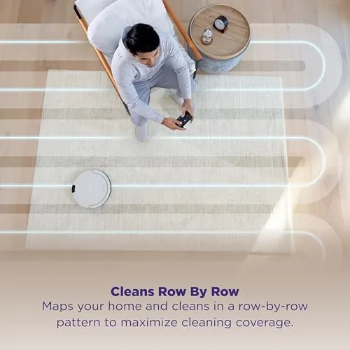 The robot vacuum tracing a cleaning path across a room with rugs