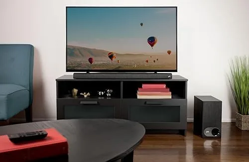 Sound bar system laid out for comparison on a media console