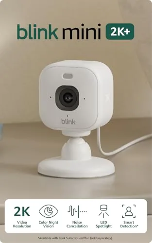 Blink Mini 2K+ camera positioned on a shelf overlooking a living room