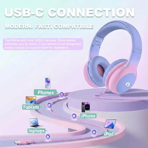 ADOOPE headphones plugged into a tablet in the back seat of a car