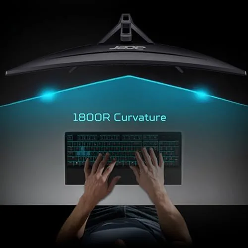 The monitor set up on a VESA arm on a clean desk with a keyboard and mouse