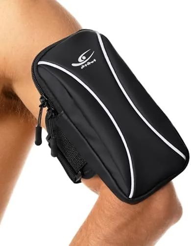 The black arm bag and wrist bag phone holder laid out on a bench before a run