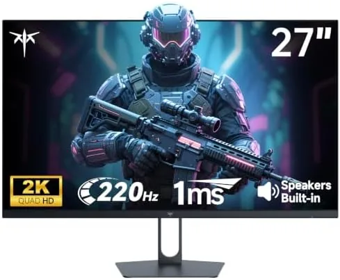 The KTC 27-inch 2K gaming monitor set up on a desk with a mechanical keyboard