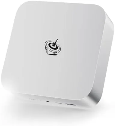 Beelink SER8 mini PC on a desk next to a monitor