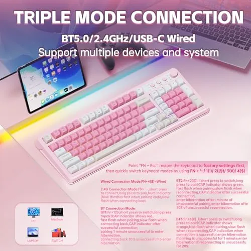 Hands typing on the AULA pink keyboard while the RGB lighting cycles through colors