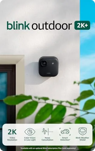 The black Blink Outdoor 2K+ camera mounted under a house eave