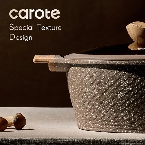 The CAROTE cookware set next to a stainless steel pan