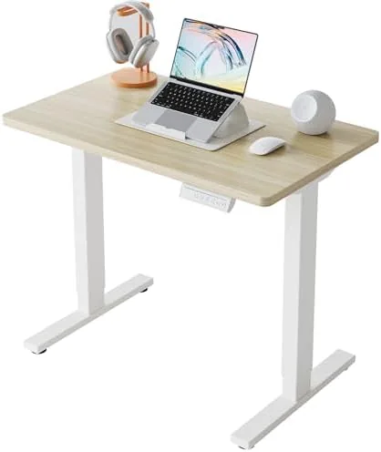 The HUANUO compact electric standing desk in a small home office