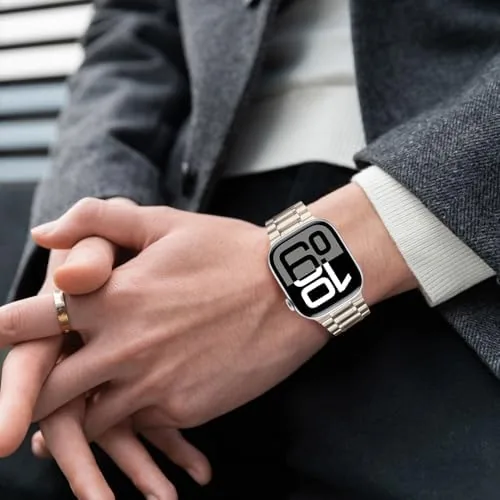 The watch on the wrist during a formal event showing the metal band under a shirt cuff