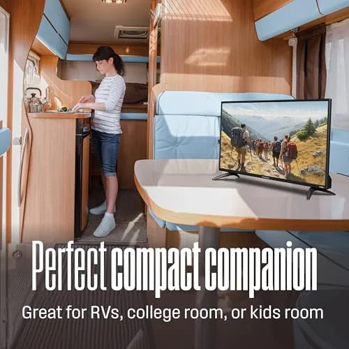 The TV on a wall mount above a desk showing the compact install