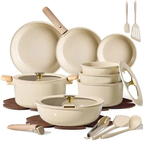 The CAROTE 25 piece ceramic cookware set in oatmeal color arranged on a counter