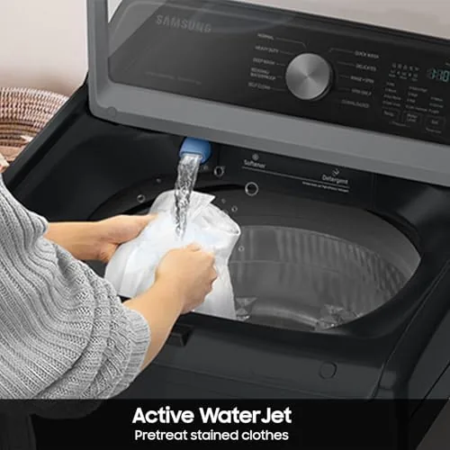 WaterJet rinsing a stain on a shirt over the washer lid
