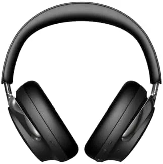 Headphones charging on a USB-C cable beside a phone