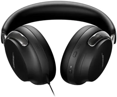 Headphones being worn on a person working in a bright room