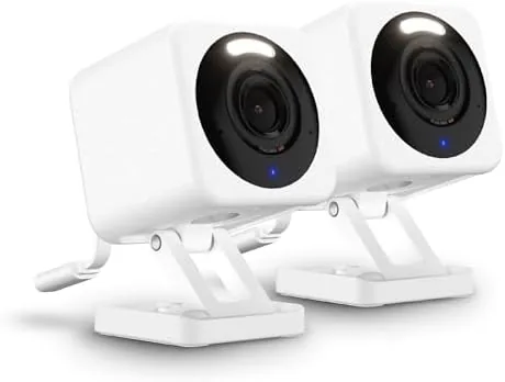 WYZE Cam v4 mounted under a porch eave pointing at a driveway
