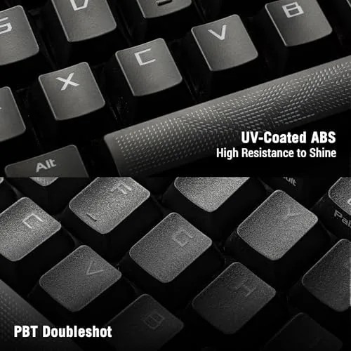 Keyboard on a desk with the cable and accessories laid out