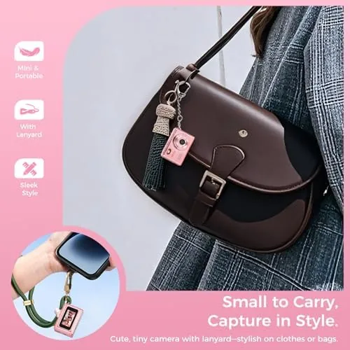 Camera hanging on a keychain with keys in hand