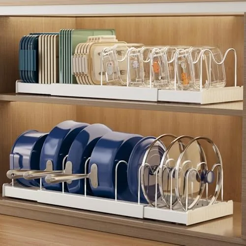 The Magheo expandable lid organizer mounted inside a kitchen cabinet with dividers holding pot lids