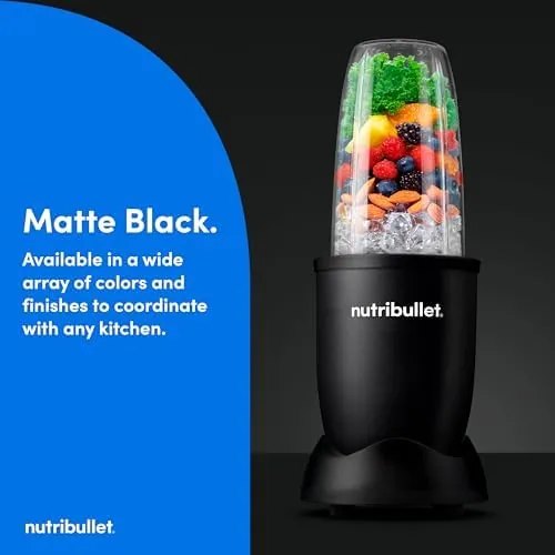 Frozen fruit and greens being pulled into the blade vortex during blending