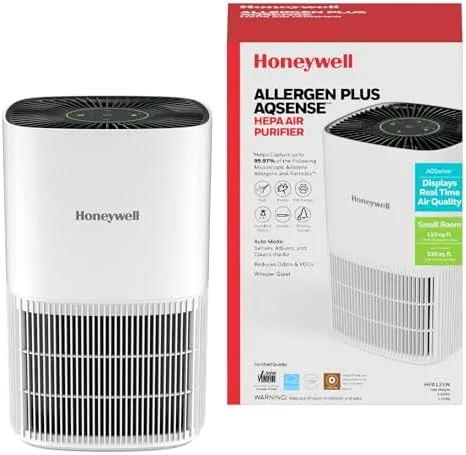 The compact Honeywell air purifier running on a nightstand in a bedroom