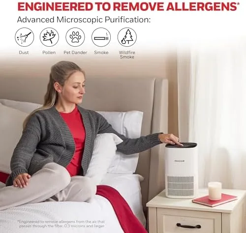 The purifier running in a corner of the bedroom with the low speed dial showing