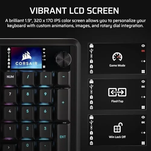 A gamer at a desk using the Vanguard 96 with the LCD display showing system stats