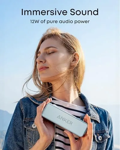 The Soundcore 2 speaker placed beside a pool with water splashes nearby