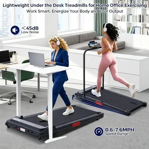 The walking pad treadmill slid underneath a standing desk with the remote control resting on the desktop