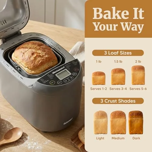 The full size bread maker beside a compact machine and a stand mixer