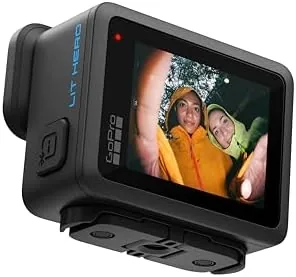 A vlogger filming a night scene with the LIT Hero light illuminating the frame