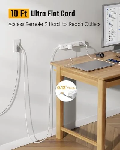 Close up of the power strip outlet arrangement with a laptop charger plugged in