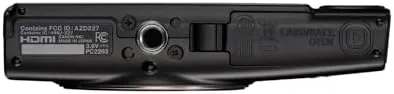 Close up of the top of the camera showing the shutter, zoom rocker, and power button