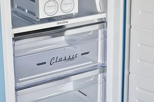 The pulled out bottom freezer drawer packed with frozen food and ice
