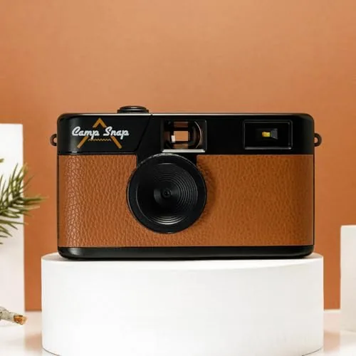 The Campsnap V105 beside a film disposable camera and a phone