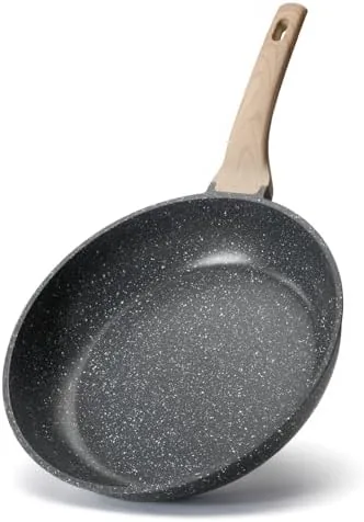 The 10-inch granite nonstick skillet on a kitchen stove with eggs cooking