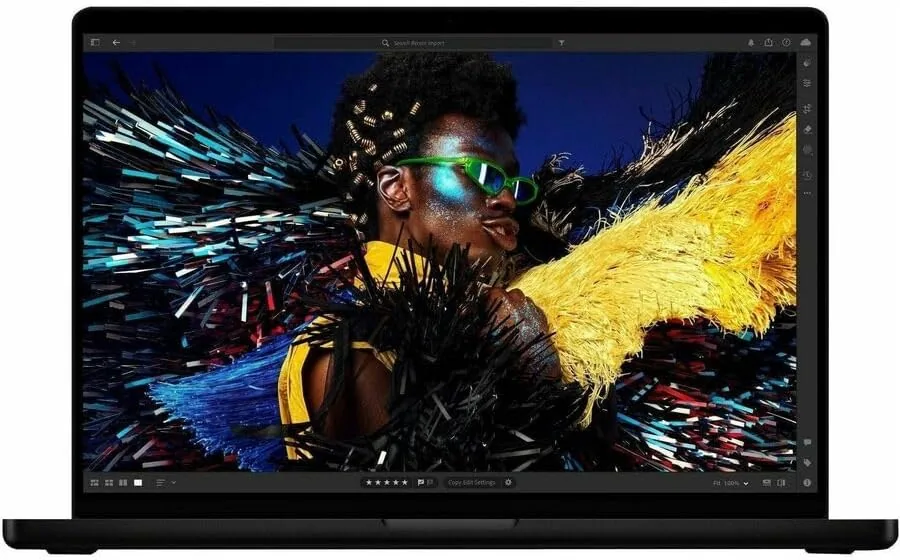 The MacBook Pro M5 running a development environment with code on screen