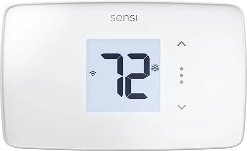 The white Sensi Lite smart thermostat mounted on a hallway wall