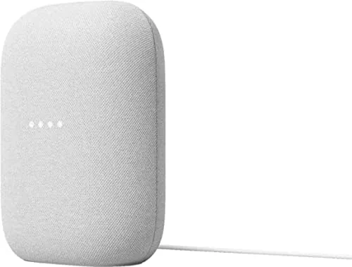 The Google Audio speaker on a desk being used with voice commands