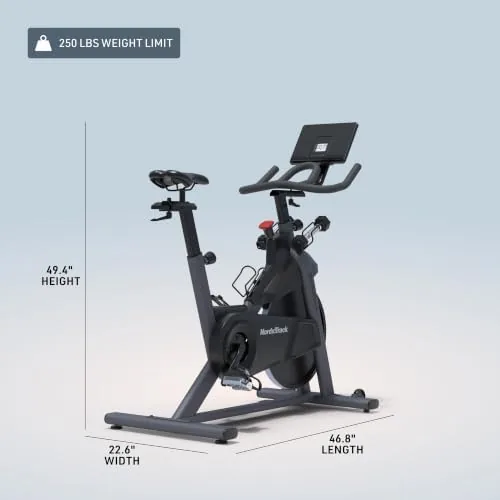 A rider in a bright living room finishing a workout on the T Series 9