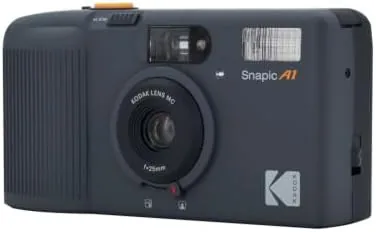 Close view of the top of the camera showing the shutter button and pop up flash