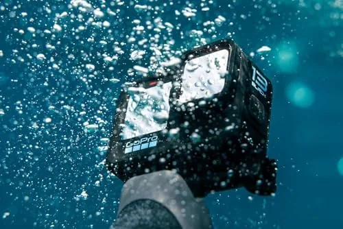 The HERO13 bundle laid out beside a bare camera and separately purchased accessories