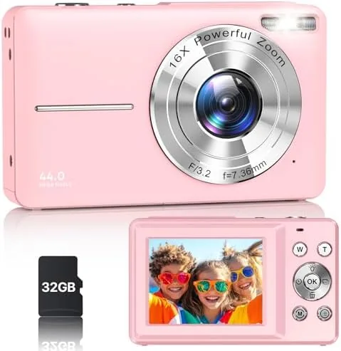 The camera laid out with its SD card, wrist strap, and charging cable after testing