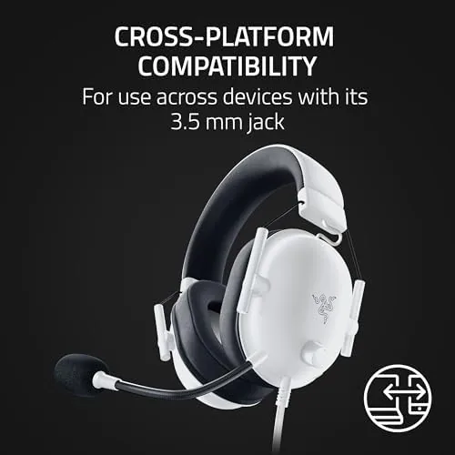 The headset resting on a gaming desk with a controller and keyboard in view