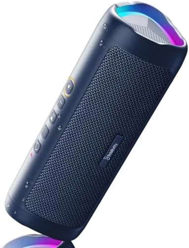 Navy 20W portable Bluetooth speaker next to a beach bag
