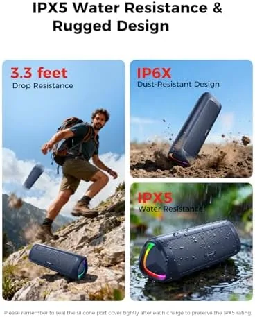 Speaker on a beach blanket with sand and spray nearby