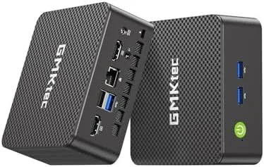 The GMKtec G3S mini PC sitting small on a desk beside a monitor