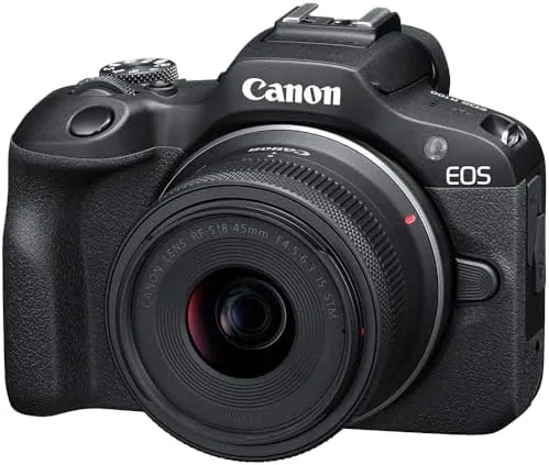 The top controls of the Canon EOS R100 showing the mode dial and shutter