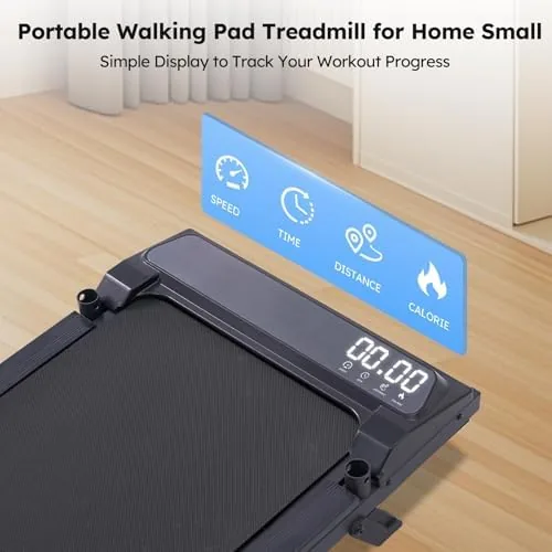 Walking pad positioned under a standing desk with a laptop on a monitor
